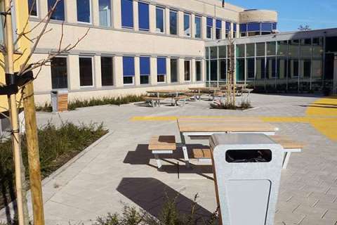 Picnic tables and litter bins at Alkwin College