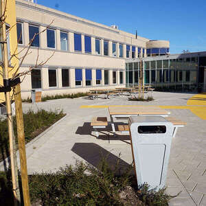 Picnic tables and litter bins at Alkwin College